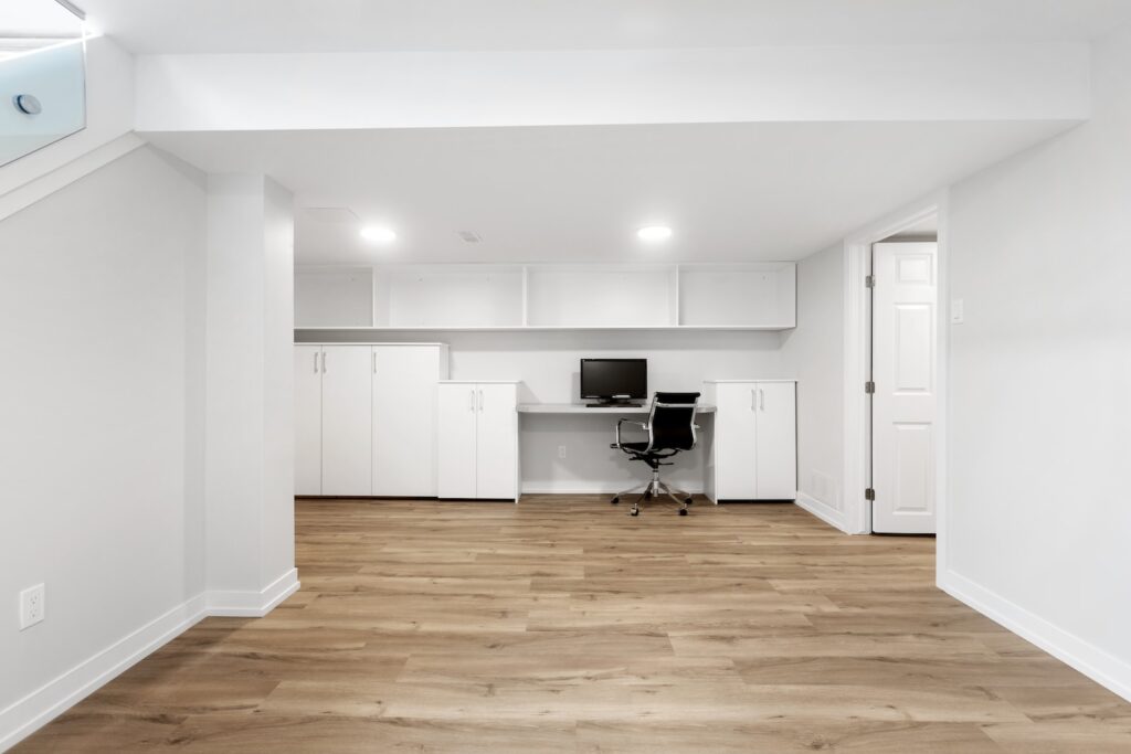 an empty room with a desk and a chair